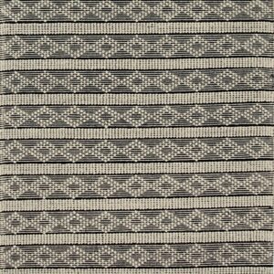 Textured black and off-white rug displaying thick horizontal bands of dotted patterns and geometric zigzags.