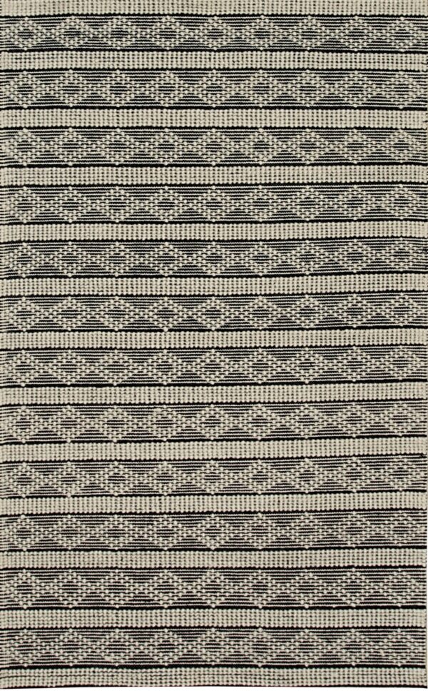 Textured black and off-white rug displaying thick horizontal bands of dotted patterns and geometric zigzags.