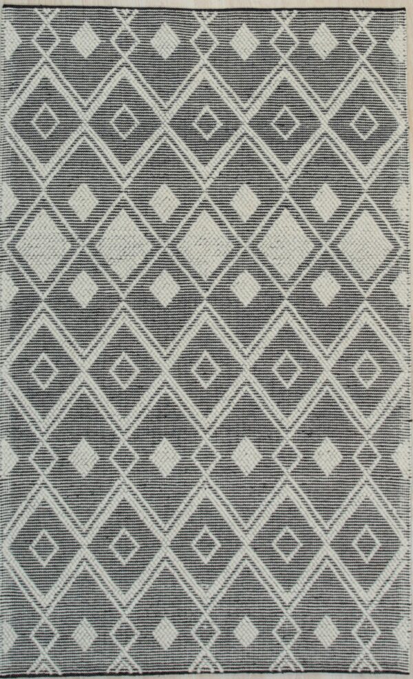 Black and white rug with repeating textured diamond motifs on a flat striped ground.