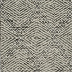 Black and off-white geometric rug with textured diamonds, zigzag patterns, and short fringes.
