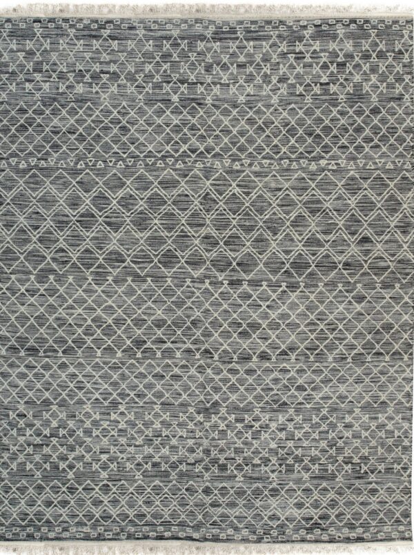 Dark gray and white rug displaying geometric bands of woven diamonds, triangles, and small squares.