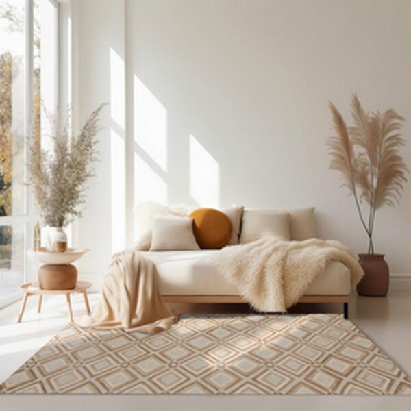 Geometric tan and cream rug sits beneath a neutral daybed in a sunlit room with large windows.
