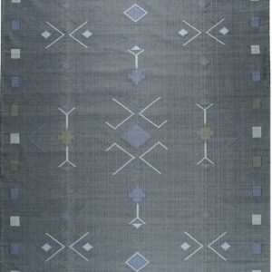 Charcoal gray flatweave rug with repeating blue, taupe, and white geometric patterns and dark tassels.