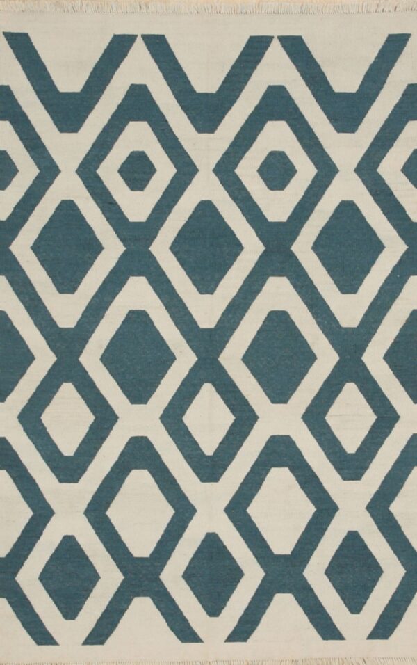 Low-pile rug showing a geometric pattern of interlocking diamonds in teal blue and cream.