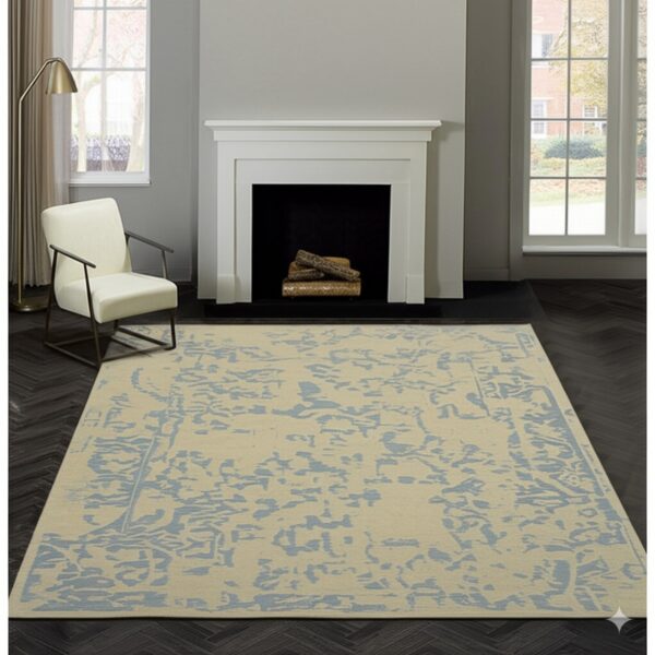 Beige and blue abstract rug sits on dark herringbone floor near a white fireplace and cream chair.