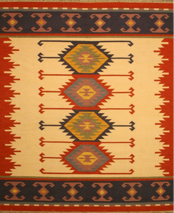 Tan and red flatweave rug with navy borders and central stepped-diamond geometric patterns.
