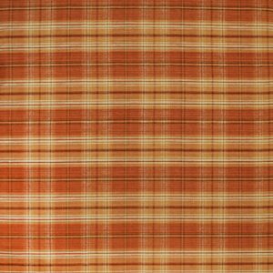 A low-pile rug featuring an orange, rust, and cream tartan plaid pattern.