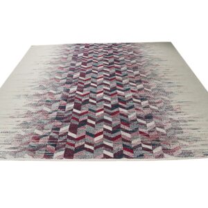 Cream rug featuring a central fading chevron pattern in burgundy, teal, and off-white colors.
