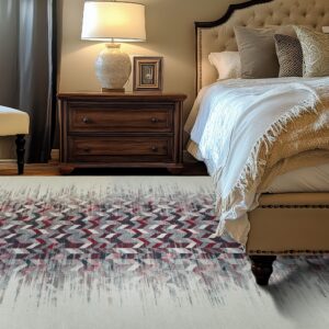 Cream rug features a distressed chevron pattern in dark red, gray, and white in a warm bedroom setting.