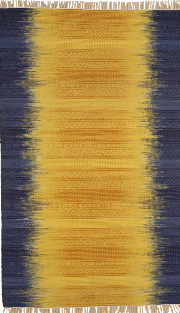 Flatwoven rug with a central vertical stripe of gold transitioning abruptly to dark blue patterned borders.