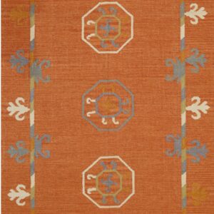Flatweave rug in terracotta with gray and white geometric medallions and stylized botanical motifs.
