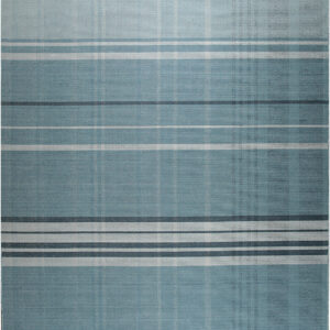 A flatweave rug in teal features an overlapping plaid pattern with white and dark blue stripes.
