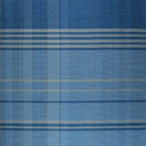 Flatwoven blue rug with a tonal plaid pattern of intersecting dark blue, light blue, and gray stripes, finished with fringe.