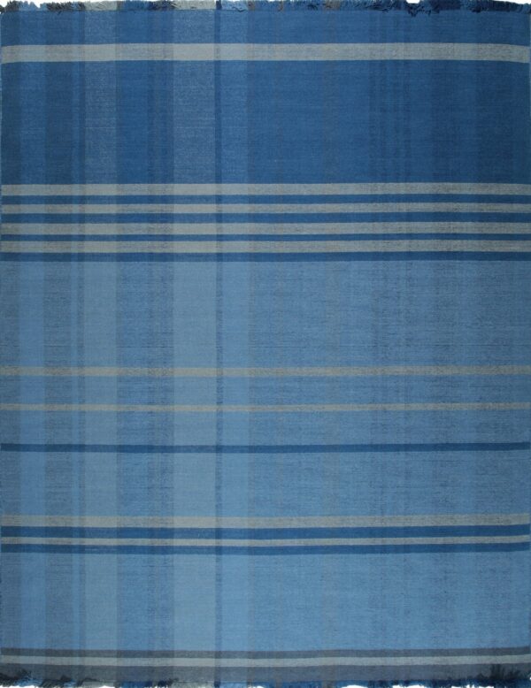 Flatwoven blue rug with a tonal plaid pattern of intersecting dark blue, light blue, and gray stripes, finished with fringe.