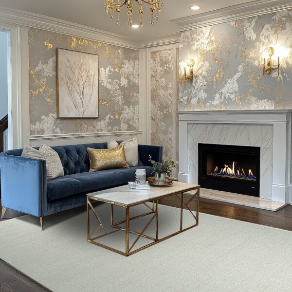 Cream textured area rug anchors a blue sofa and fireplace on dark wood flooring.