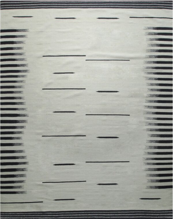 Flatwoven rug featuring a light field with scattered dark dashes and bold, feathered side borders.