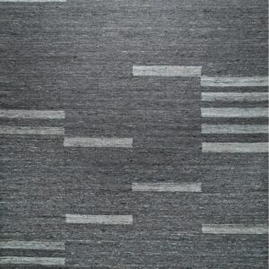 Textured dark gray rug with a geometric pattern of staggered light gray horizontal bands.