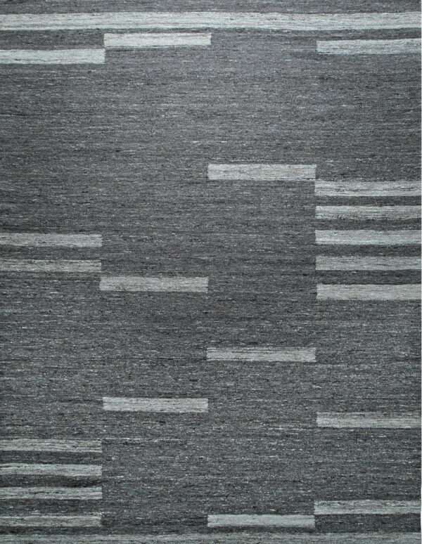 Textured dark gray rug with a geometric pattern of staggered light gray horizontal bands.
