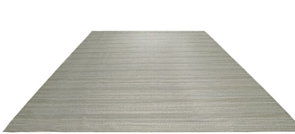 Muted gray flatweave rug with alternating horizontal bands of plain weave and detailed geometric patterns.