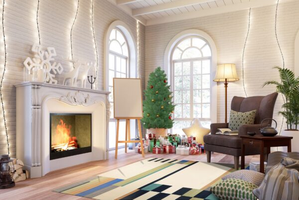 Cream geometric rug featuring blue, green, and tan blocks on wood flooring in a festive room.