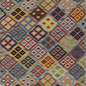 Richly textured rug with a multicolored geometric diamond pattern over a heathered gray field.
