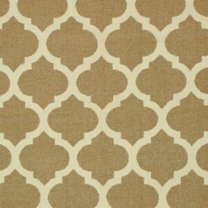 A low-pile rug displays a repeating tan and off-white quatrefoil lattice pattern.