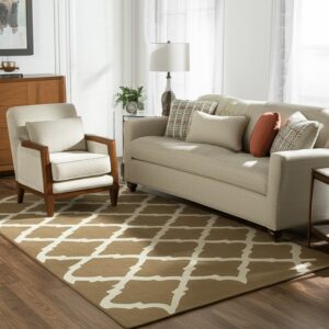 Tan and cream geometric rug on wood flooring anchors a sitting area with beige seating and sheer curtains.