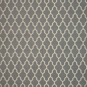 Gray flatweave rug with a repeating off-white geometric trellis pattern filling the frame.