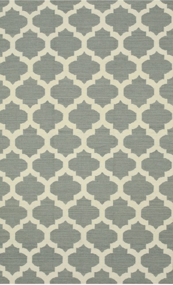 Woven rug featuring a cream trellis pattern against a textured dusty blue-gray background.