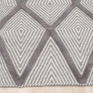 Gray and off-white rug featuring a high-low textured geometric diamond pattern on light wood floor.