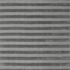 Horizontal stripes in alternating dark gray and medium gray cover the rug surface.