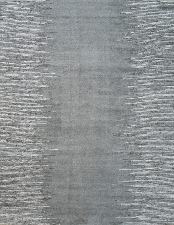 Gray rug with a dense center transitioning to textured white and dark gray horizontal streaking sides.