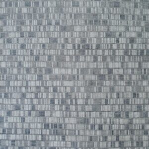 Textured gray rug featuring a modern geometric pattern of densely arranged vertical dashes and rectangles.