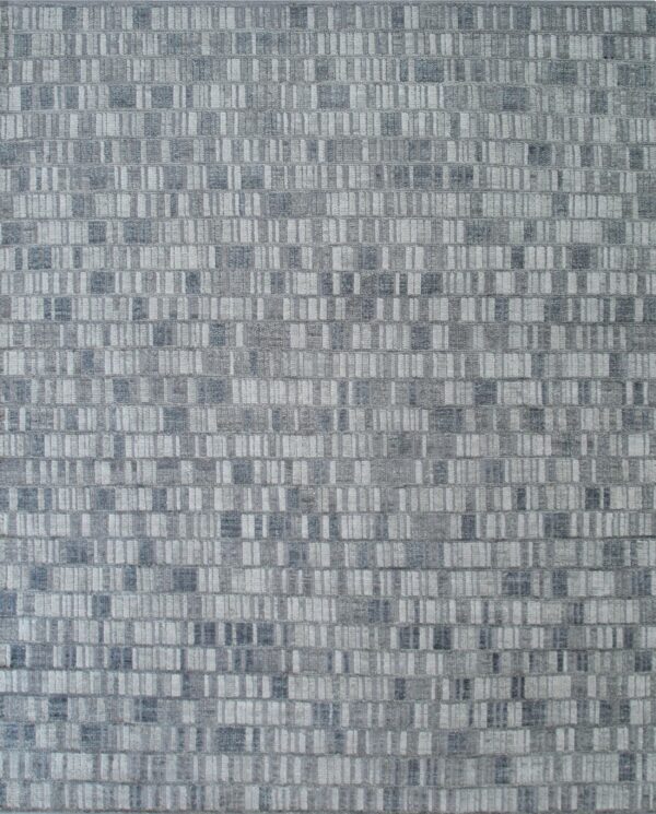 Textured gray rug featuring a modern geometric pattern of densely arranged vertical dashes and rectangles.