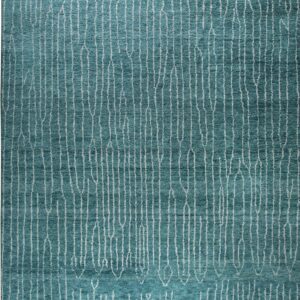 Teal textured rug with vertical abstract white lines covering the surface and visible fringe.