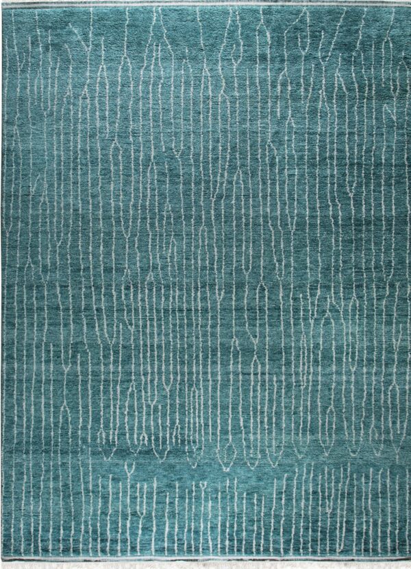 Teal textured rug with vertical abstract white lines covering the surface and visible fringe.