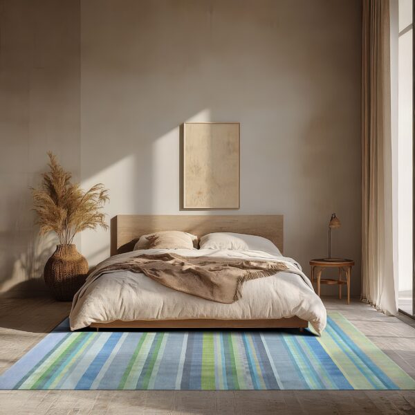 A blue and green striped rug lies on a stone floor in a serene, minimalist bedroom setting.