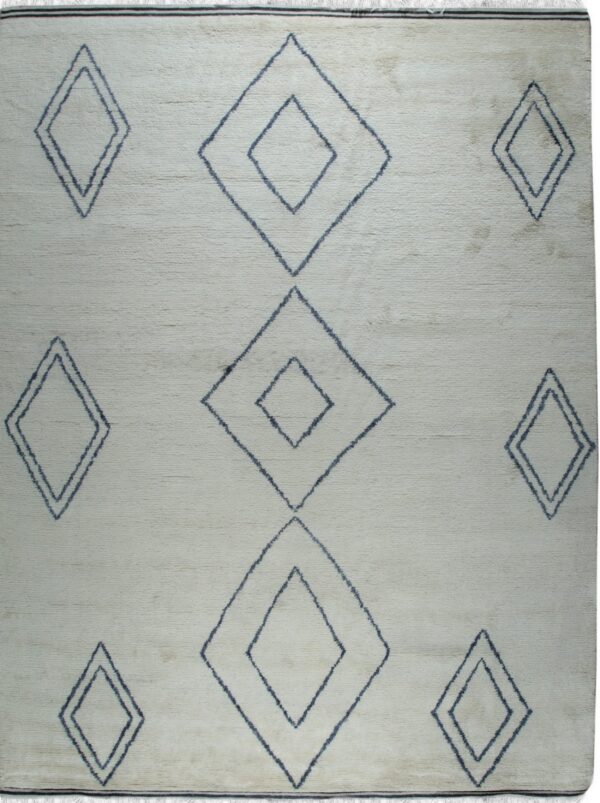 Cream textured rug with dark blue outlined geometric diamonds and short visible fringe.