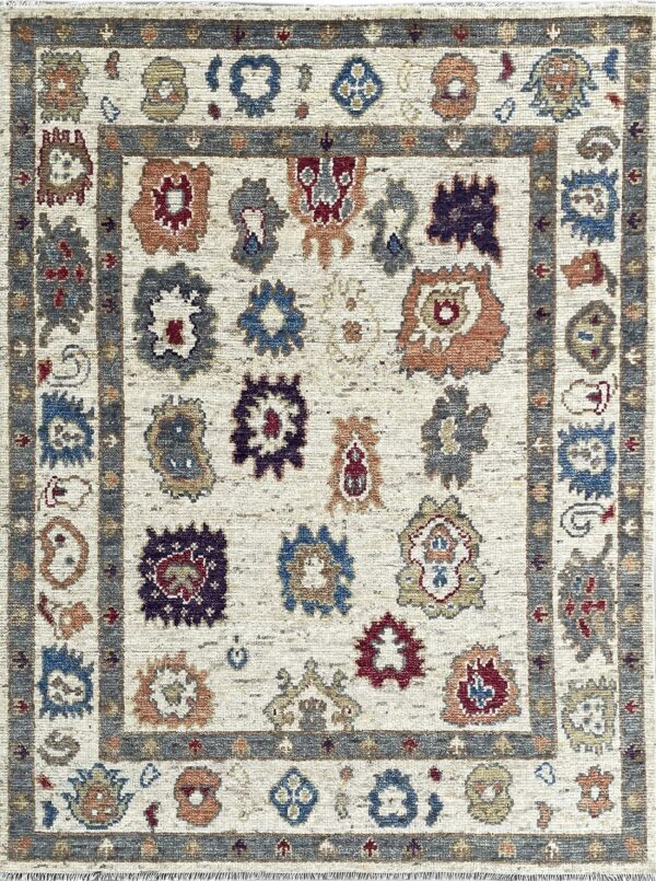 Textured off-white rug with a gray border framing spaced red, blue, and rust stylized tribal patterns.