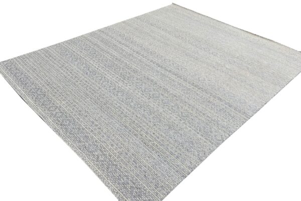 A gray and cream low-pile rug with fine textured vertical stripes and subtle patterning.