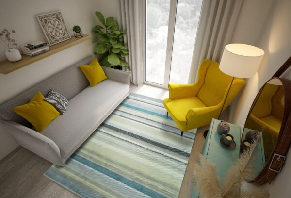 Low-pile rug with fine horizontal stripes in blue, green, and gray under modern living room furniture.