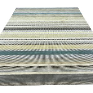 Multicolored rug with striped pattern of segmented vertical lines in gray, black, teal, and pale yellow.