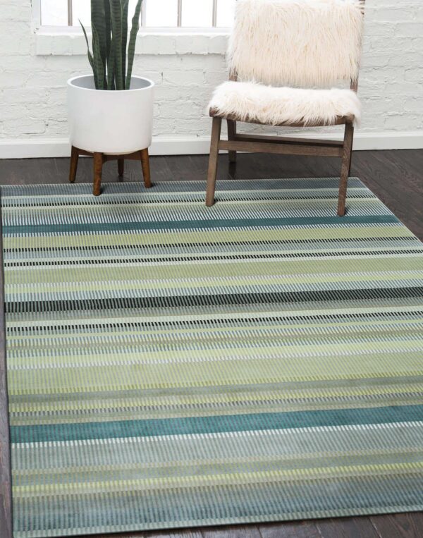 A low-pile rug with teal, lime green, and gray vertical stripes covers a dark wood floor.