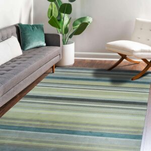 Green, teal, and gray striped rug in a living room with a gray sofa and hardwood floor.