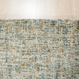 Mottled blue, cream, and tan chunky loop rug texture borders light wooden plank flooring.