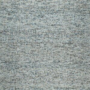 Textured rug with an abstract, variegated pattern of blue, gray, and brown dashes.