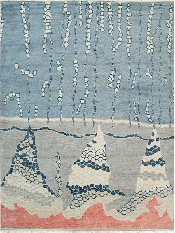 Blue, gray, and coral rug with abstract mountains, vertical white lines, and hexagonal patterns.