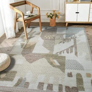 Modern abstract rug with textural blocks in beige, brown, and light blue rests on herringbone wood floor.