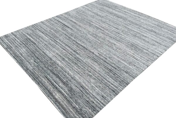 Gray and black rug with thin, closely spaced vertical lines, angled on a white background.