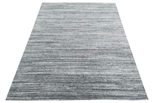 A rectangular rug featuring a textured horizontal stripe pattern in charcoal and gray.